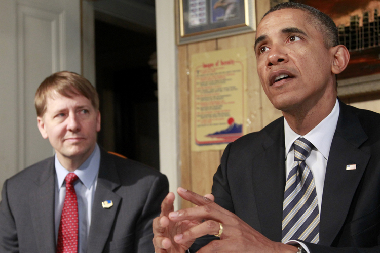 President Barack Obama, accompanied by Richard Cordray, speaks during his visits with William and Endia Eason, not pictured, Wednesday, Jan. 4, 2012, at their home in Cleveland, Ohio. (AP/Haraz N. Ghanbari)