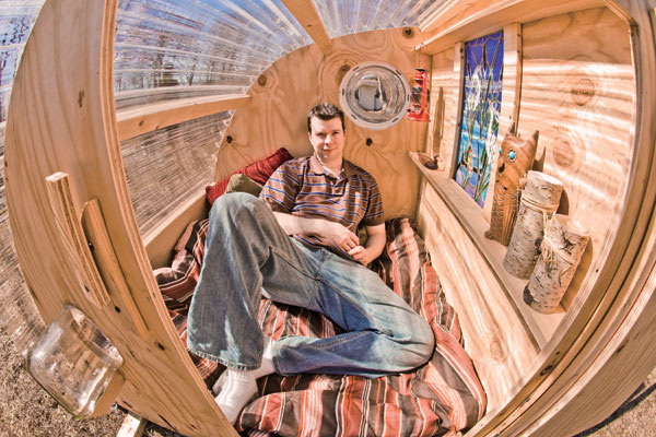 Author Deek Diedricksen in his $100 disaster relief shelter, the "GottaGiddaWay." (Bruce Bettis/Reprinted with permission from Lyons Press)
