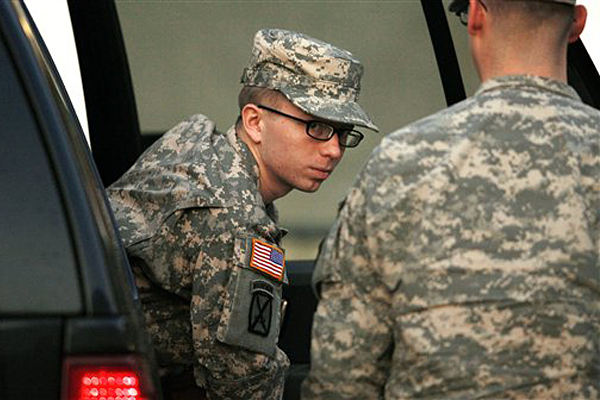 Army Pfc. Bradley Manning is escorted from a security vehicle to a courthouse in Fort Meade, Md., Monday, Dec. 19, 2011, for a military hearing (AP/Patrick Semansky)