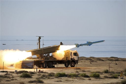 In this picture released by Iranian Students News Agency on Monday, Jan. 2, 2012, a missile is launched at the shore of sea of Oman during Iran's navy drill (AP Photo/ISNA, Amir Kholousi)