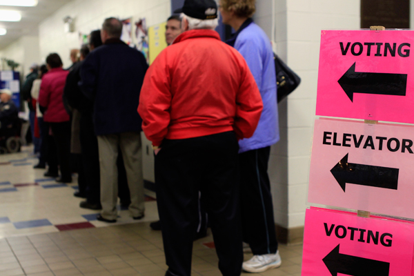 Voters wait in line to cast their ballot (Reuters/Adam Hunger)