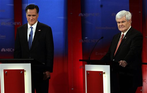Republican presidential candidates, former Massachusetts Gov. Mitt Romney, left, stands next to former House Speaker Newt Gingrich before a Republican Presidential debate Monday Jan. 23, 2012, at the University of South Florida in Tampa, Fla. (AP Photo/Paul Sancya) (AP)
