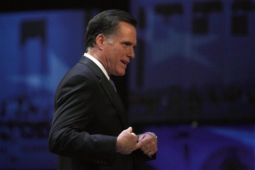 Former Massachusetts Gov. Mitt Romney reacts as he walks off the stage after a Republican presidential candidate debate at the Capitol Center for the Arts in Concord, N.H., Sunday, Jan. 8, 2012. (AP Photo/Charles Krupa) (AP)