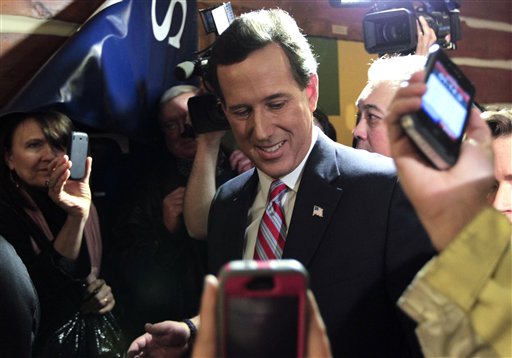 Republican presidential candidate former Pennsylvania Sen. Rick Santorum speaks during his caucus night rally in Johnson, Iowa, Tuesday, Jan. 3, 2012. (AP Photo/Chris Carlson) (AP)