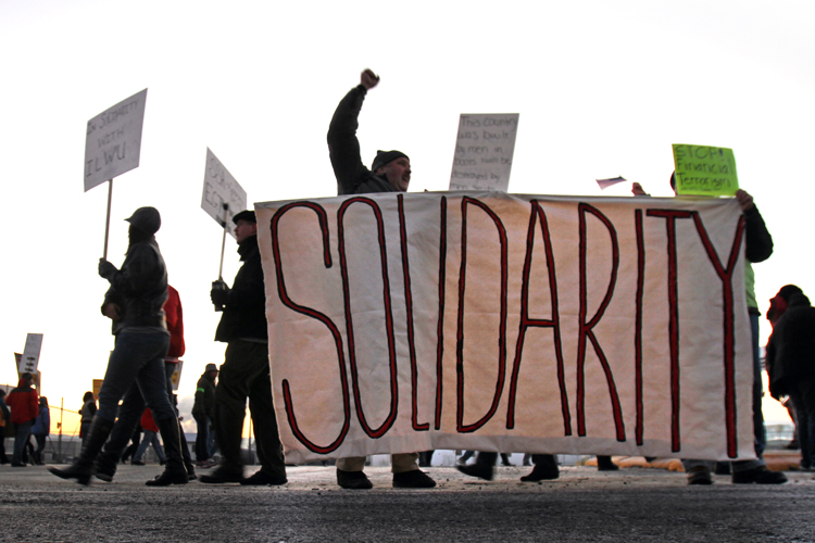 Occupy protesters block an entrance to the Port of Longview in Longview, Wash., Monday, Dec. 12, 2011. (AP/Don Ryan)