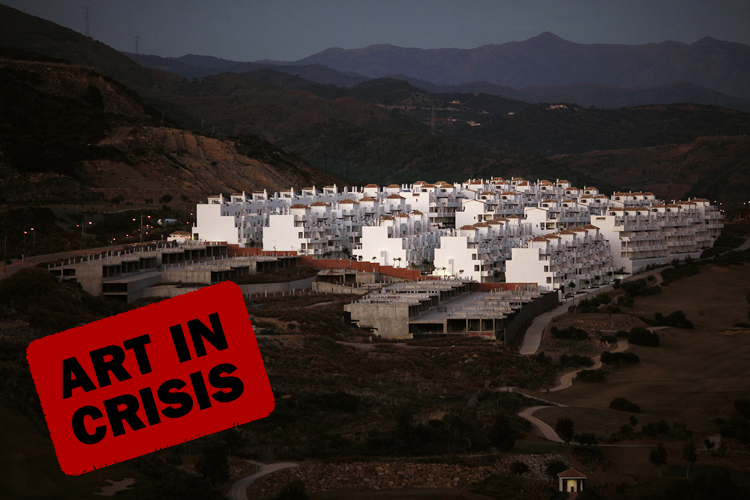 An unfinished residential building (left) is seen on a mountain in Estepona, near Malaga, southern Spain, Jan. 31, 2012. (Jon Nazca / Reuters)