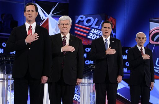 CORRECTS LOCATION TO THE UNIVERSITY OF NORTH FLORIDA, INSTEAD OF UNIVERSITY OF SOUTH FLORIDA - Republican presidential candidates, from left, former Pennsylvania Sen. Rick Santorum, former House Speaker Newt Gingrich, former Massachusetts Gov. Mitt Romney and Rep. Ron Paul, R-Texas, stand during the National Anthem at the Republican presidential candidates debate at the University of North Florida in Jacksonville, Fla., Thursday, Jan. 26, 2012. (AP Photo/Paul Sancya) (AP)