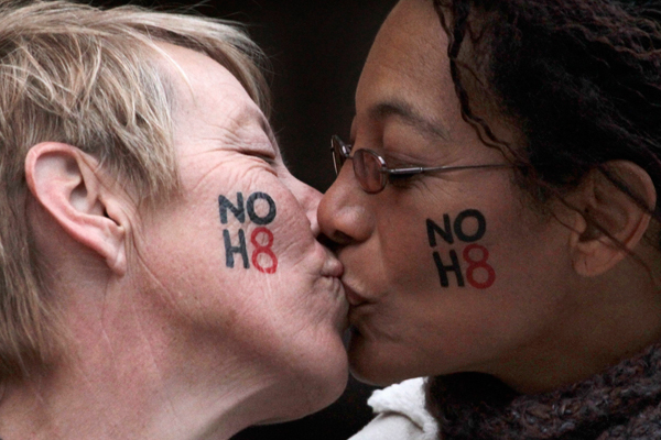 Lori Campbell (L) and Maja Roble, who are engaged, kiss at a celebration rally for Tuesday's ruling on Proposition 8 in West Hollywood, California February 7, 2012 (Reuters/Jonathan Alcorn)