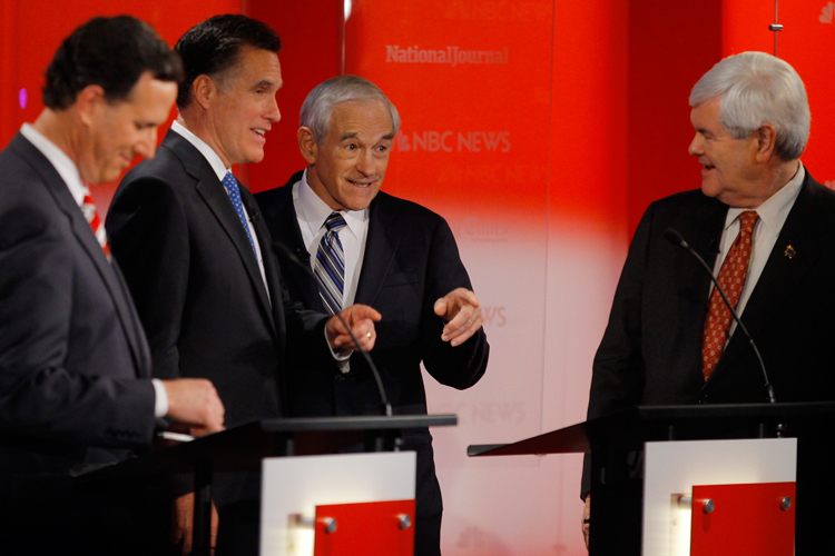 Republican presidential candidate Rick Santorum listens as fellow candidates Mitt Romney, Ron Paul, and Newt Gingrich chat during a break in the Republican presidential candidates debate in Tampa, Florida, January 23, 2012. (Reuters)