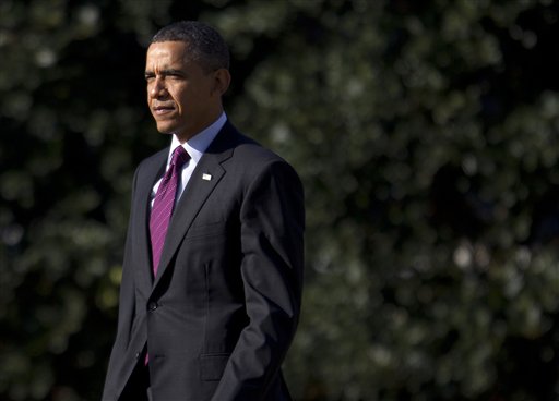 President Barack Obama walks to Marine One on the South Lawn of the White House in Washington, Wednesday, Jan. 25, 2012.  (AP Photo/Evan Vucci) (AP)