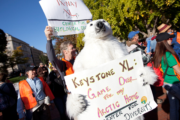 Protestors outside the White House demand a stop to the Keystone XL tar sands oil pipeline. (AP/Evan Vucci)