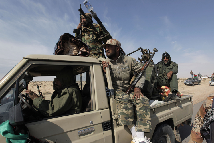 Libyan rebels head towards the front line outside the eastern town of Brega, Libya Friday, April 1, 2011 (AP)
