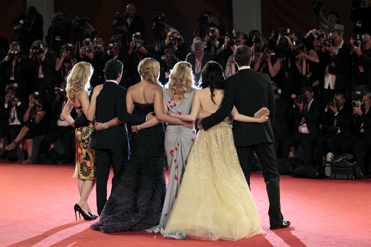 Actors pose for photographers on the red carpet at the Venice Film Festival (Alessandro Bianchi / Reuters)