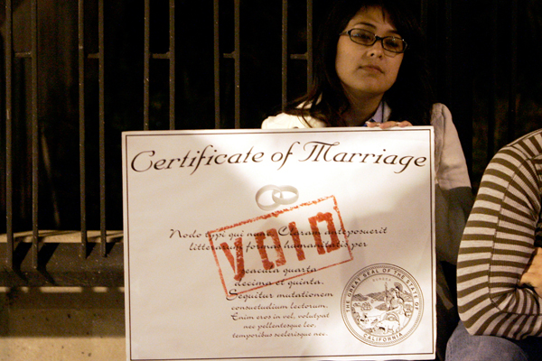 A protester holds a mock marriage certificate while demonstrating during an anti-Proposition 8 rally in Los Angeles. (Reuters/Danny Moloshok)