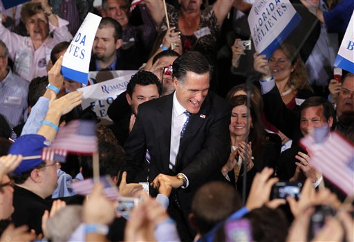 Republican presidential candidate, former Massachusetts Gov. Mitt Romney, greets supporters at his Florida primary primary night rally in Tampa, Fla., Tuesday, Jan. 31, 2012. (AP Photo/Gerald Herbert) (AP)