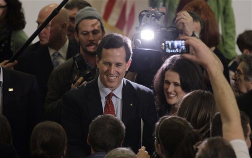 Republican presidential candidate, former Pennsylvania Sen. Rick Santorum, left, with his daughter, Elizabeth, right, visits with supportes during a campaign rally, Sunday, Feb. 26, 2012, in Davison, Mich.  (AP Photo/Eric Gay) (AP)
