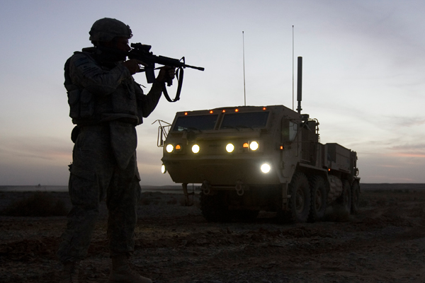 A U.S. Marine aims his rifle during a route clearance mission across a desert in Helmand province, southern Afghanistan (Reuters/Shamil Zhumatov)