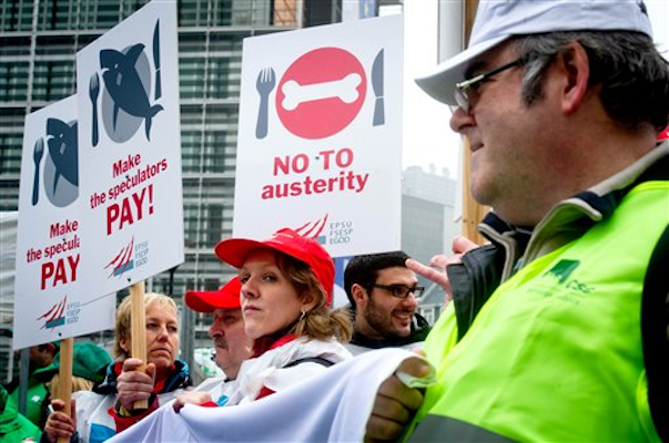 European Trade Union members demonstrate for employment and social justice in front of the EU Council in Brussels, Wednesday Feb. 29, 2012 (AP Photo/Geert Vanden Wijngaert)