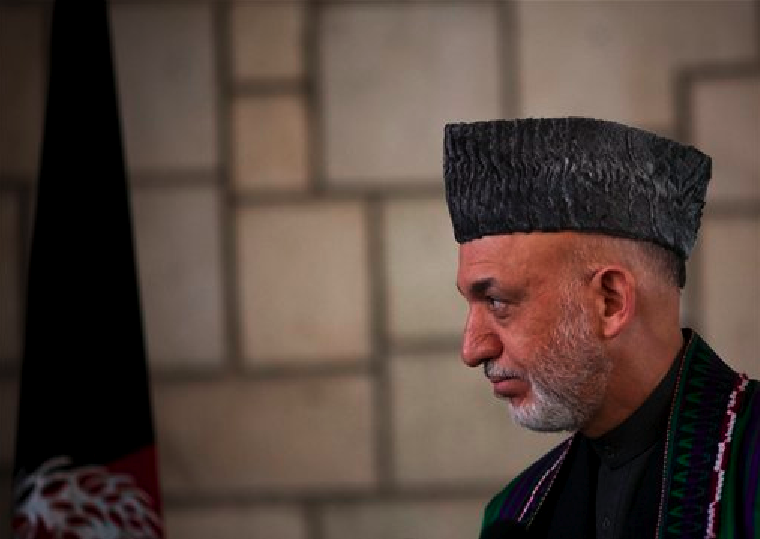 Afghan President Hamid Karzai looks on during a news conference in Kabul, Afghanistan, Tuesday, March 6, 2012. (AP Photo/Anja Niedringhaus)