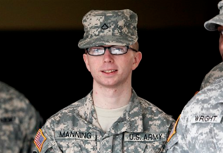 FILE - In this file photo taken Dec. 22, 2011, Army Pfc. Bradley Manning is escorted from a courthouse in Fort Meade, Md. (AP Photo/Patrick Semansky, File)