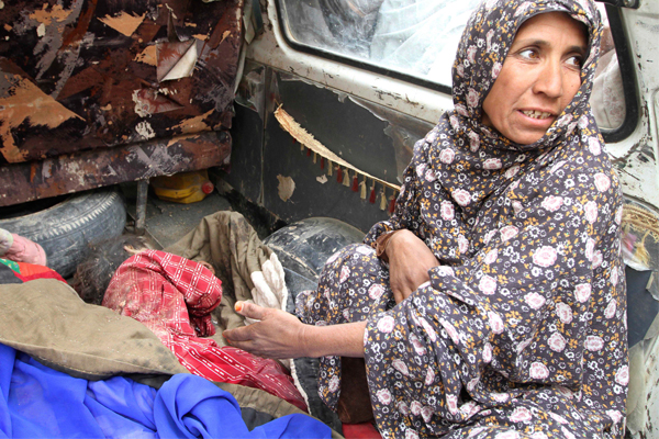 Anar Gul gestures to the body of her grandchild, who was allegedly killed by a U.S. service member in Panjwai, Kandahar, on Sunday. (AP/Allauddin Khan)
