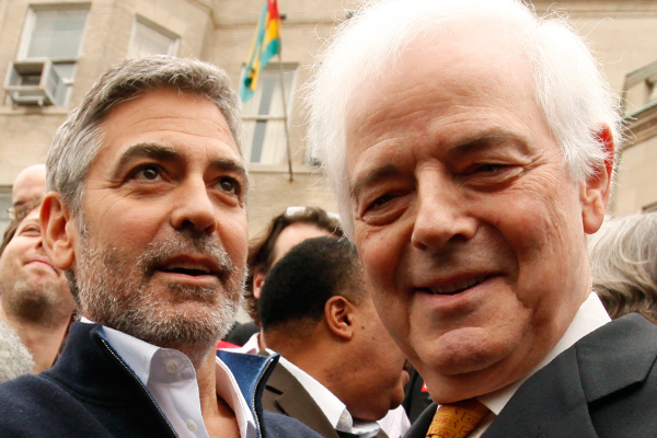 George and Nick Clooney  on the steps of the Sudan Embassy in Washington, D.C., on March 16. (Reuters/Kevin Lamarque)