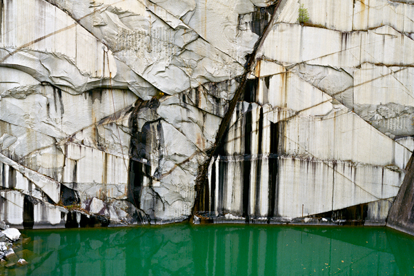 Detail from Edward Burtynsky's "Rock of Ages #4, Abandoned Section, Adam-Pirie Quarry, Barre, Vermont, 1991." (See slide show for the complete photograph.) Digital chromogenic color print. (Photograph courtesy Howard Greenberg & Bryce Wolkowitz, New York / Nicholas Metivier, Toronto.)