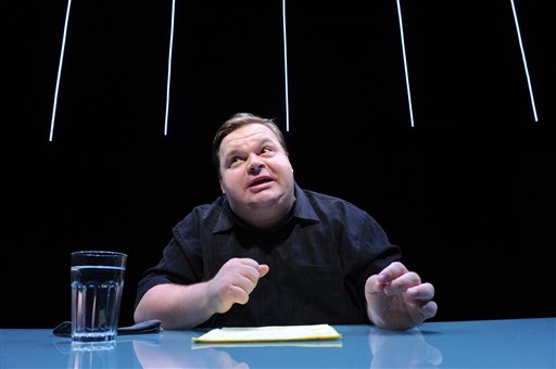 In this undated image released by The Public Theater, Mike Daisey is shown in a scene from "The Agony and The Ecstasy of Steve Jobs," in New York. Daisey, whose latest show has been being credited with sparking probes into how Apple's high-tech devices are made, is finding himself under fire for distorting the truth. The public radio show This American Life retracted a story Friday, March 16, 2012, that it broadcast in January about what Daisey said he saw while visiting a factory in China where iPads and iPhones are made. (AP Photo/The Public Theater, Stan Barouh) (AP)