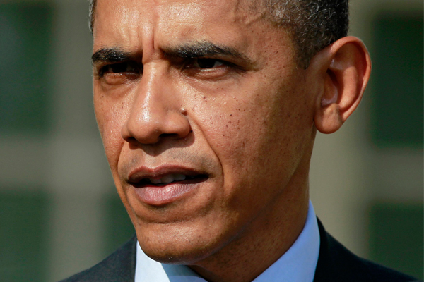 President Obama answers a reporter's question about the death of Trayvon Martin. (AP/Haraz N. Ghanbari)