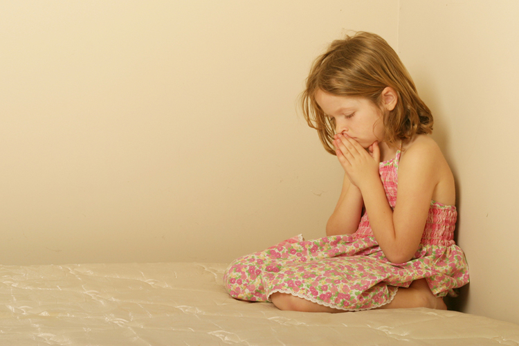 (<a href='http://www.shutterstock.com/pic-51045340/stock-photo-young-girl-praying.html'>Sean Bolt</a> via <a href='http://www.shutterstock.com/'>Shutterstock</a>)