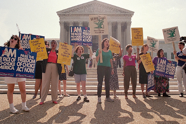 Pro-choice advocates gather outside the Supreme Court on June 26, 1992, awaiting the court's decision on Pennsylvania's abortion restrictions. (AP/Barry Thumma)