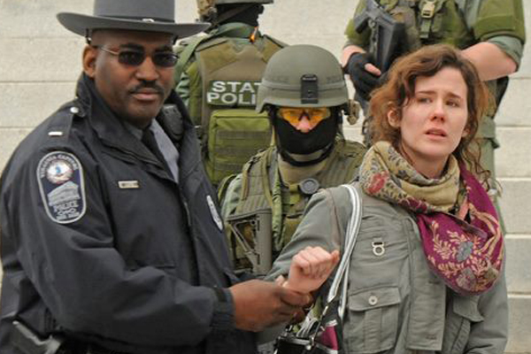 A woman protesting Virginia's mandatory ultrasound law is arrested on the capitol steps in Richmond on March 3. (<a href='https://www.facebook.com/media/set/?set=a.10150720349477642.471133.48762312641&type=3'>Style Weekly</a>)