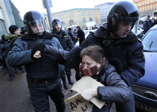 Russian police officers detain an opposition protester during a protest near the Central Election Committee in Moscow, Monday, March, 5, 2012 (AP Photo/Sergey Ponomarev)