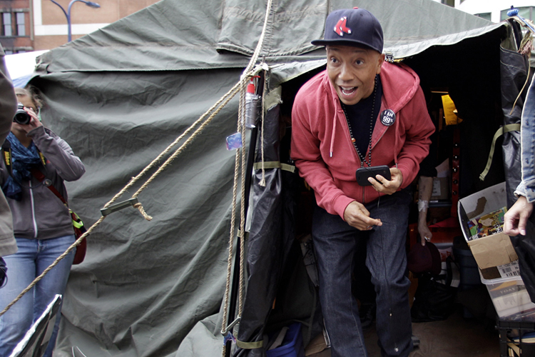 Hip-hop mogul  Russell Simmons, seen here at Occupy Boston, is co-hosting an arts festival called "All in for the 99%" (AP/Stephan Savoia)