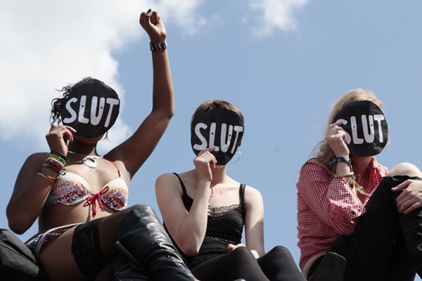 SlutWalk participants cheer a speaker (Olivia Harris / Reuters)