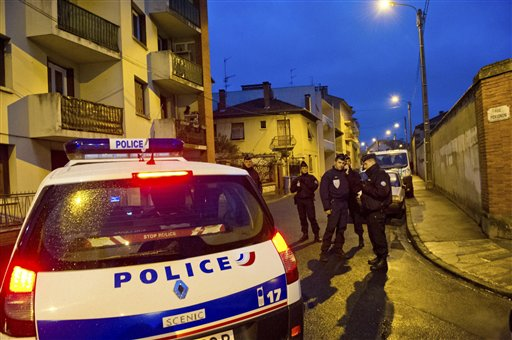 French police secure the area where they exchanged fire with a gunman who claims connections to al-Qaida and is suspected of killing three Jewish schoolchildren, a rabbi and three paratroopers, Wednesday, March 21, 2012 in Toulouse, southwestern France (AP Photo/Bruno Martin)