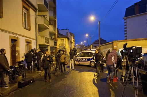 ournalists gather near by as French police secure the area where they exchanged fire and were negotiating with a gunman who claims connections to al-Qaida and is suspected of killing three Jewish schoolchildren, a rabbi and three paratroopers, Wednesday, March 21, 2012 in Toulouse, southwestern France (AP Photo/Bruno Martin)