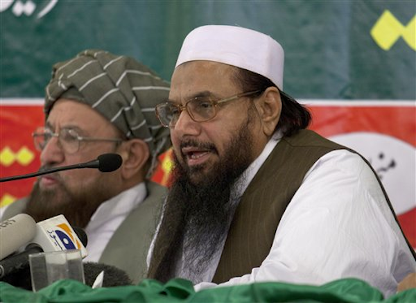 Hafiz Mohammad Saeed, right, chief of Jamaat-ud-Dawwa and founder of Lashkar-e-Taiba, addresses a news conference with anti-American cleric Sami ul Haq in Rawalpindi, Pakistan on Wednesday, April 4, 2012. (AP Photo/B.K. Bangash)