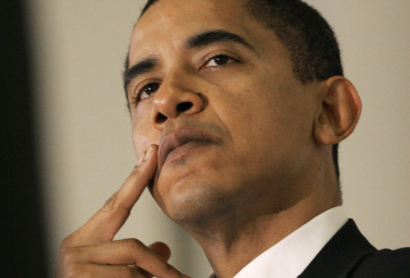 In this March 10, 2006, file photo, U.S. Sen. Barack Obama, D-Illinois, listens during a Democratic rally in Burlington, Vt. (AP Photo/Toby Talbot, File)