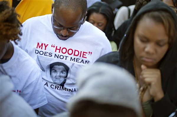A demonstrator wears a t-shirt in memory of Trayvon Martin during a rally outside the Georgia Capitol, in Atlanta on Monday, March 26, 2012 (AP Photo/David Goldman)