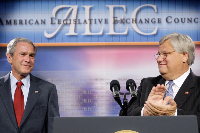 President George W. Bush, left, is introduced by Rep. Kenny Marchant prior to speaking at the American Legislative Exchange Council in 2007. (AP/Pablo Martinez Montsivais)