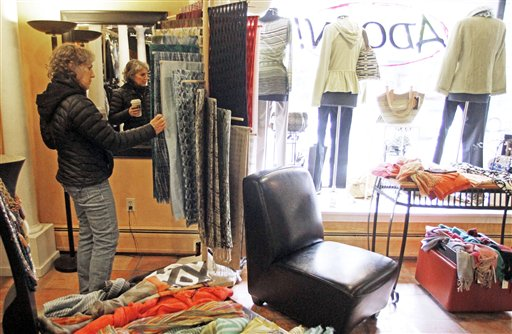 In this Feb. 28, 2012, Laurie Hanson looks over clothing at the Adorn clothing store in Montpelier, Vt. (AP Photo/Toby Talbot)