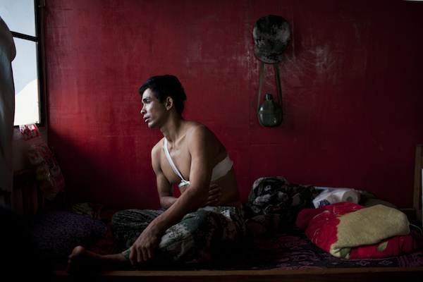 Saw Htet Aung, a 42-year-old soldier in the Kachin Independence Army, recovers at Laiza Military Hospital, near Laiza, Burma, March 30, 2012. Saw Htet Aung was shot in the torso while on patrol in Ban Dawng, on March 21, 2012. (Will Baxter/GlobalPost)