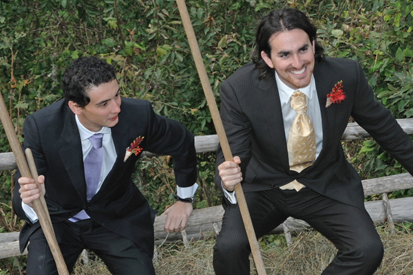 The groom (right) is driven by hay cart (which he recently filled using a wooden pitchfork) in victory up to the church, after having successfully conquered the feats of manliness. (Iztok Grilc)