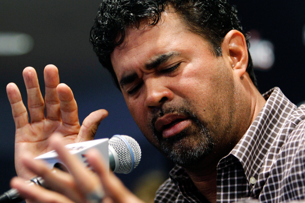A contrite Miami Marlins manager Ozzie Guillen gestures at a news conference on Tuesday. (AP/Lynne Sladky)