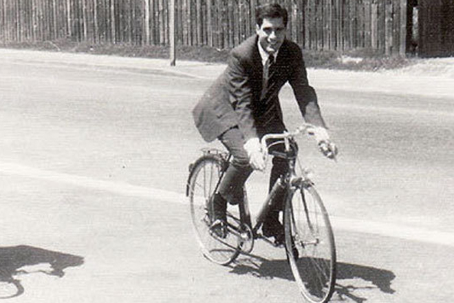A young Romney rides a bicycle in France. (André Salarnier)