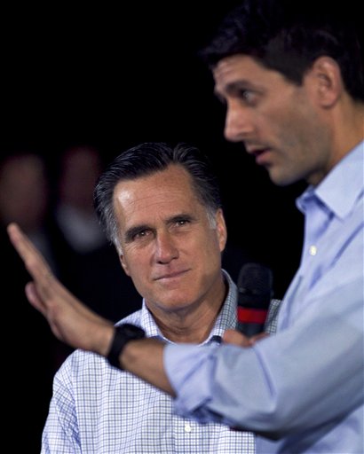 Republican presidential candidate, former Massachusetts Gov. Mitt Romney,  left, watches as U.S. Rep. Paul Ryan, R-Wis., Chairman of the House Budget Committee, right, addresses an audience during a Romney campaign event at an oil company in Milwaukee, Monday, April 2, 2012. (AP Photo/Steven Senne) (AP)