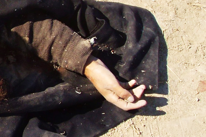 The hand of a combatant killed in Afghanistan, taken from the author's personal stash of "war porn." (John Rico)