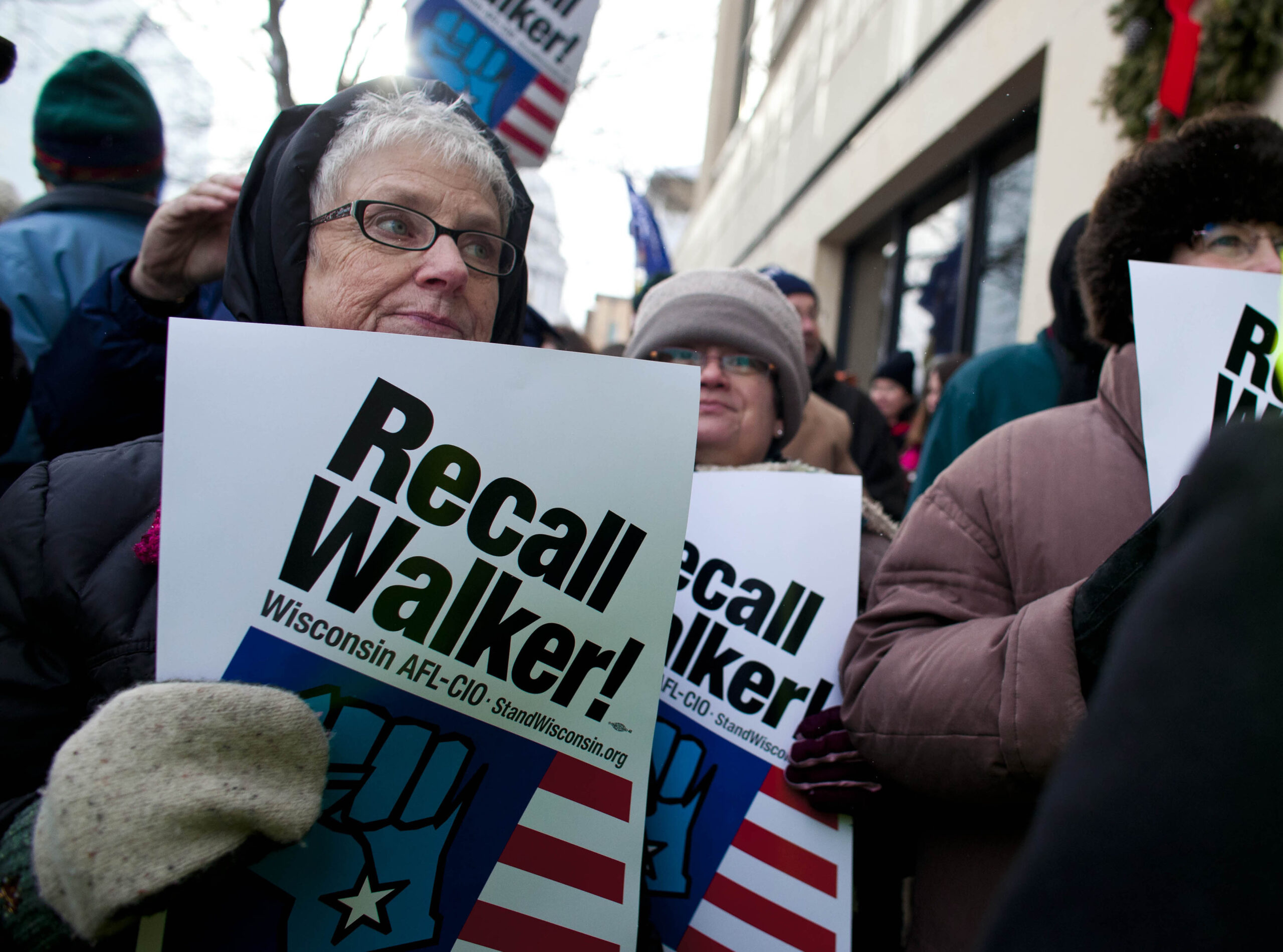 Supporters show up in support before a truck with the boxes containing about one million signed recall petitions forms in Madison, Wisconsin January, 17, 2012. (Reuters/Darren Hauck)