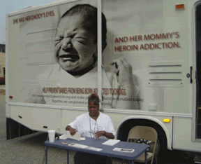 A volunteer outside a Project Prevention van (<a href="http://www.projectprevention.org/">Project Prevention</a>)
